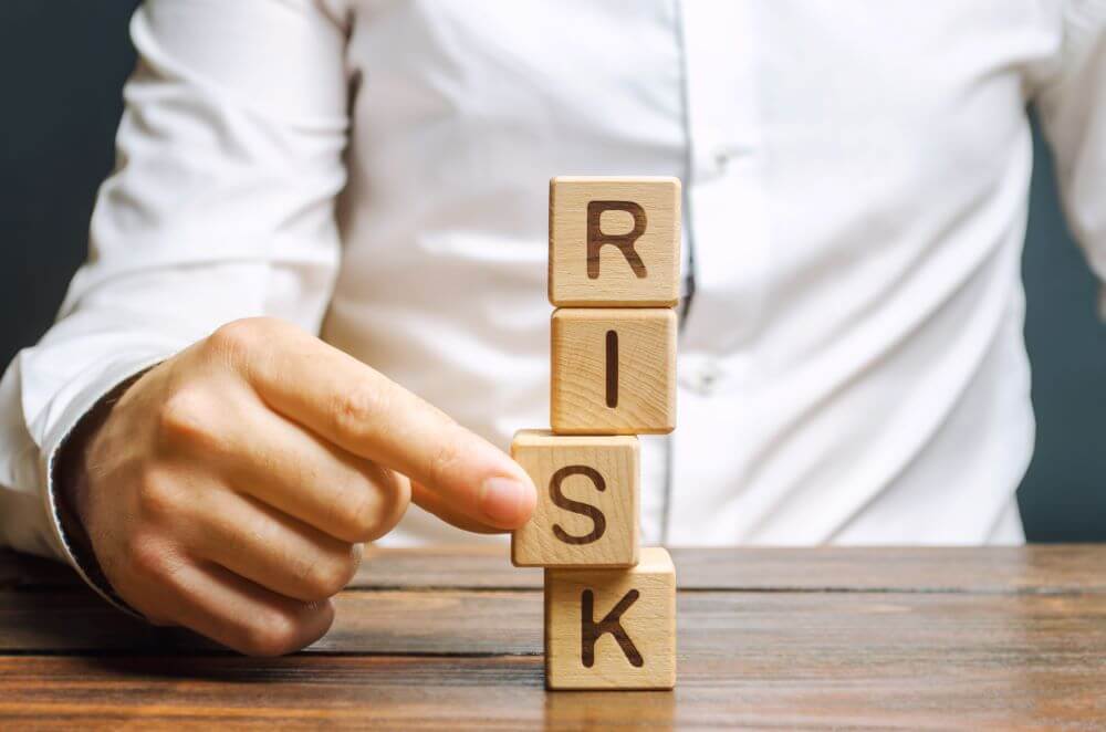 man stacking blocks for business risk