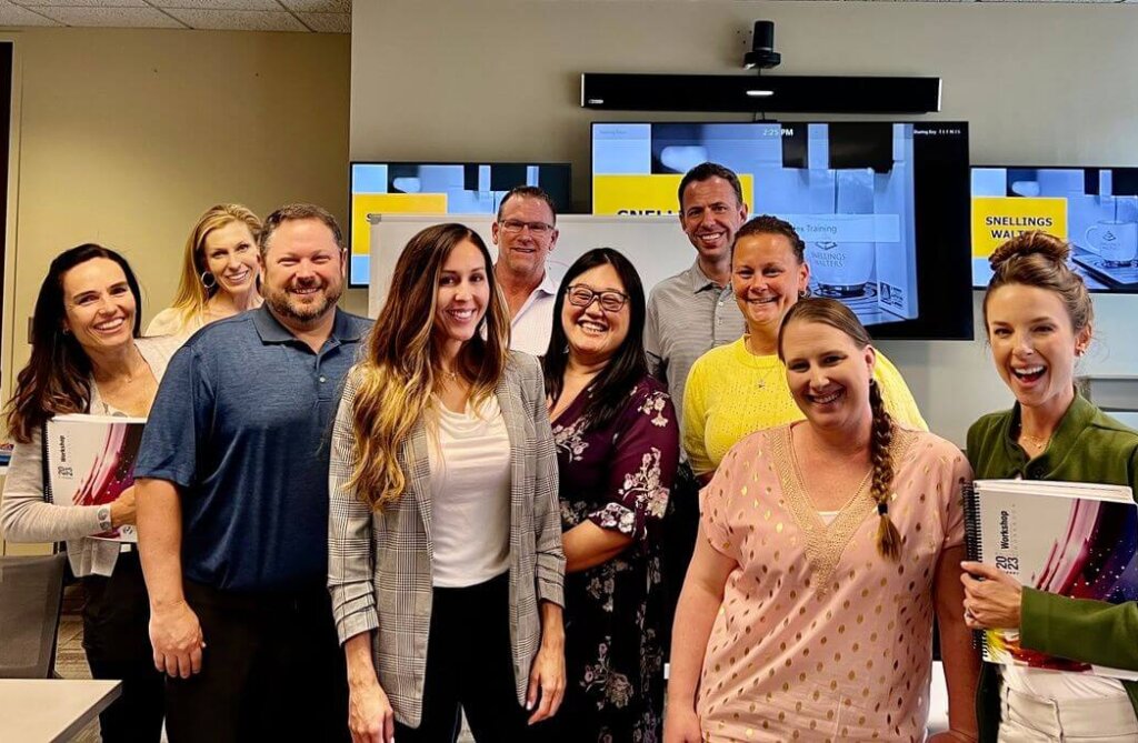 A group from the Snellings team smiling together after a training on the Culture Index