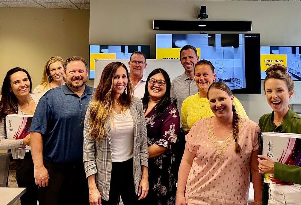 A group from the Snellings team smiling together after a training on the Culture Index